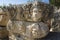 Theatrical mask and face stone relief of ancient town of Myra in Lycia, Ruins of ancient city of Myra in Demre