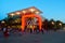 Thematic Store with red neon lights in Lake Buena Vista on blue sky backround.