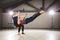 The theme of Acroyoga and Yoga Poses. Acroyogis practicing. with the studio Backlight. The woman Base keeps the man Flyer in the h