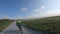 The theme is a bicycle trip through the north of France, the region of Brittany and Normandy. POV view of cyclists on a