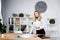 Theme business woman at work. Beautiful young caucasian woman business man working standing in the office near the table, checks