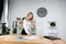 Theme business woman at work. Beautiful young caucasian woman business man working standing in the office near the table, checks