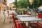 Theme cafes and restaurants. Exterior summer terrace of bright colors of street cafe shop in Europe in France. Preserved tables Wi