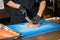 Theme cooking is a profession of cooking. Close-up of a Caucasian man`s hand in a restaurant kitchen preparing red fish fillets