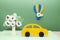 Theme is eco-friendly transport, a balloon with flowers, a flowering tree and a car on a green