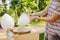 Theme is a family small business cooking sweets. Hands close-up A young male shopkeeper holding a merchant makes candy floss, fair