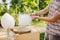 Theme is a family small business cooking sweets. Hands close-up A young male shopkeeper holding a merchant makes candy floss, fair