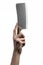 The theme of the kitchen: Chef hand holding a large kitchen knife for cutting meat on a white background isolated