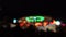 Theme park at night. Defocused spinning LED lit attraction. 4K background bokeh shot