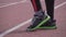 Theme sport and health. Close-up feet shoes sneakers Mooda Caucasian man runner warm-up runner warm up stretching