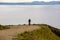 Theme tourism and cycling on mountain biking. guy rides uphill on a rocky, rocky road against the background of the Mediterranean