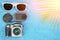 Theme of travel. Video photo gadgets with glasses lie on a colored background.