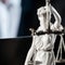 Themis figurine.  Wooden judge`s gavel. The criminal law.