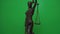 Themis statuette rotates on the background of chromakey