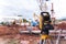 Theodolite equipment  of Surveyor builder engineer during surveying work in construction site