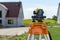 Theodolite on tripod on yard