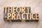 Theory and practice word abstract in wood type