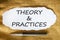 Theory and practices symbol. Words `Theory and practices` on white paper. Black metallic pen. Beautiful canvas background.