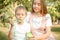 Ther and sister blowing soap bubbles