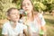 Ther and sister blowing soap bubbles