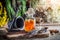 Therapeutic herbs in bottles with herbs and alcohol