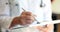 Therapist doctor hands make notes with pen in medical write