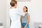 Therapist examines a young girl patient. Throat in neck, thyroid enlargement