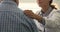 Therapist during pep talk put hand on older patient shoulder