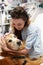 Therapy Dog Visiting Young Female Patient In Hospital