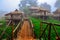 There are Akha homestays located on a hillside covered and foggy background at Doi Sa Ngo ,Chiang Rai , Thailand