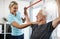There doesnt seem to be any problems with your strength. a mature female physiotherapist working with a senior male