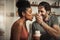 And there we go. Cropped shot of an affectionate middle aged man feeding his wife dessert in their kitchen at home.