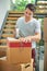 There we go, thats the last one. a young man packing up his belongings into boxes before moving out.