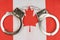 There are handcuffs on the flag of Canada.