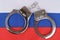 There are handcuffs on the flag of Russia.