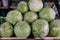 There are a lot of cabbages on the counter. Close-up. Sale of vegetables at the farmers market