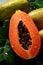 There are a lot of wet papaya fruits. Selective focus.