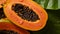 There are a lot of wet papaya fruits. Selective focus.