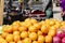 There are many oranges arranged in a store