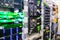 There are many racks with servers in the server room of the data center.Blurred background