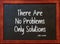 There are no problems only solutions. Motivational Quote by John Lennon on blackboard