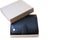 There is an opened gift box with a good, expensive wallet made of black genuine leather