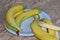 there are ripe bananas and peels on a blue plate