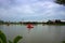 There is a river landscape, a park with a red pedal boat, a relaxing, relaxing concept.