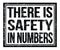 THERE IS SAFETY IN NUMBERS, text on black grungy stamp sign