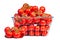 There is a shopping basket full of red ripe tomatoe. Conceptual image of buying vegetables and healthy eating.