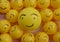 There are smiley faces drawn on yellow balls.