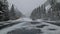 There is snowy day over mountains in forest of scenic highway in the West Yellowstone Montana United States
