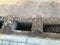 There are special holes in the asphalt for laying future sewage. preparation for the creation of a water drainage system. without