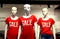 There are three mannequins in the shop in a red T-shirt with the words sale